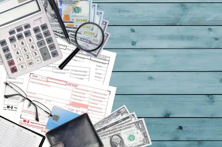 Documents and magnifying glass: IRS Notice 2020-54