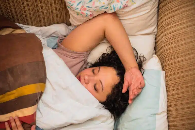 woman sleeping in bed eESI Live Well: 10 Tips to Better Sleep